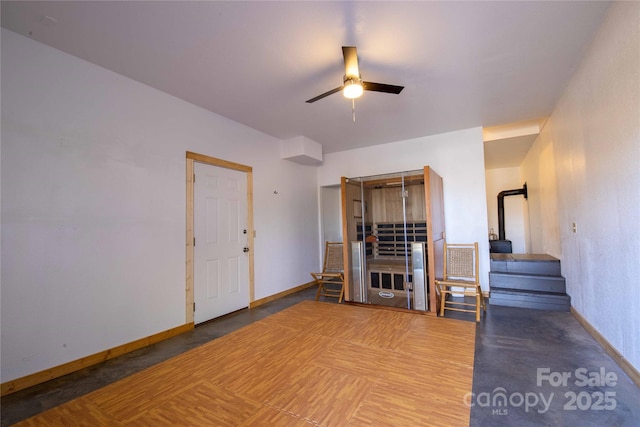 693 Blackberry Ridge Rd, Burnsville, NC 28714 - living area featuring a ceiling fan, baseboards, and stairway