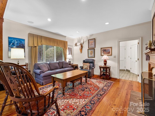 1360 Skunk Hollow Rd, Campobello, SC 29322 - living room featuring light wood-style floors, crown molding, recessed lighting, a fireplace, and baseboards