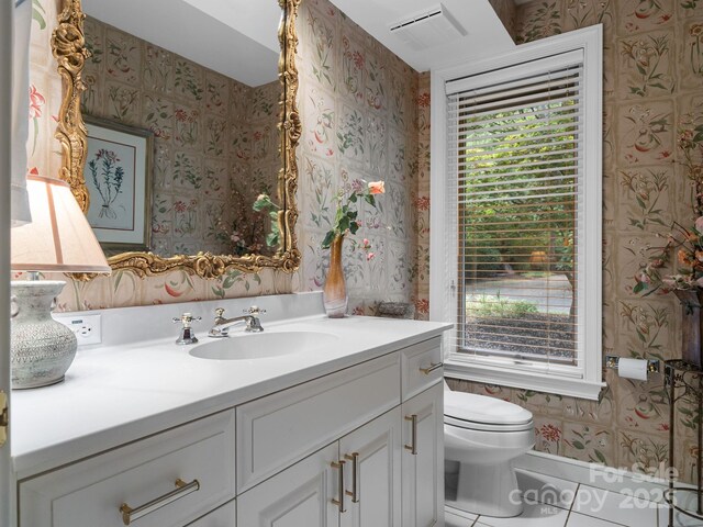1360 Skunk Hollow Rd, Campobello, SC 29322 - bathroom featuring wallpapered walls, plenty of natural light, vanity, toilet, and tile patterned flooring
