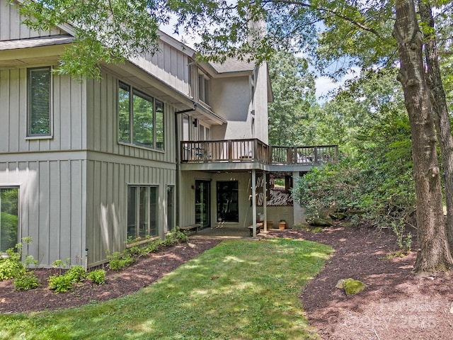 1360 Skunk Hollow Rd, Campobello, SC 29322 - back of house featuring a wooden deck, board and batten siding, and a lawn