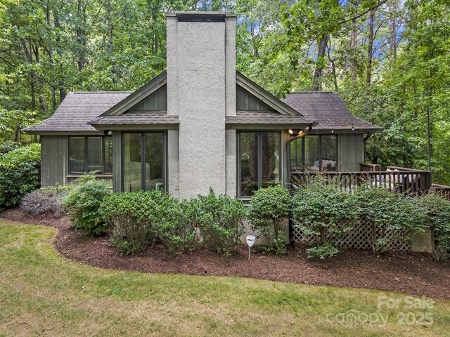 1360 Skunk Hollow Rd, Campobello, SC 29322 - back of property featuring a chimney, roof with shingles, a deck, and a lawn