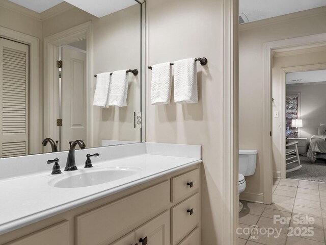 1360 Skunk Hollow Rd, Campobello, SC 29322 - bathroom with toilet, tile patterned floors, ornamental molding, and vanity