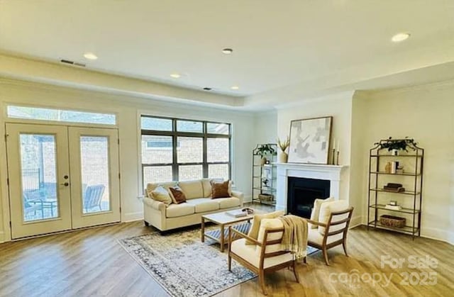409 Newstyle Way, Gastonia, NC 28056 - living room with plenty of natural light, wood finished floors, a fireplace, french doors, and recessed lighting