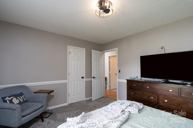 103 Poplar Trl, Rockwell, NC 28138 - carpeted bedroom with baseboards, a textured ceiling, and a closet