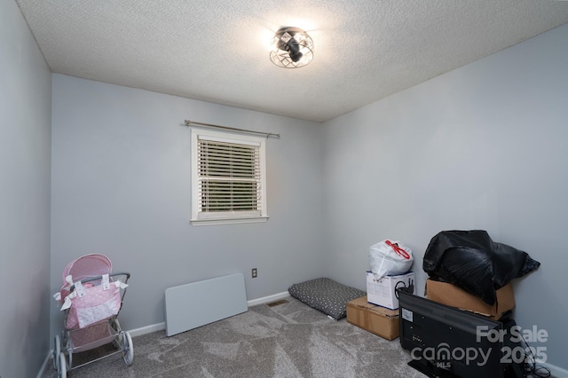 103 Poplar Trl, Rockwell, NC 28138 - misc room with carpet flooring, a textured ceiling, and baseboards