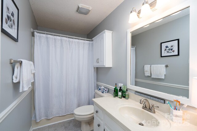 103 Poplar Trl, Rockwell, NC 28138 - bathroom with toilet, vanity, and a textured ceiling