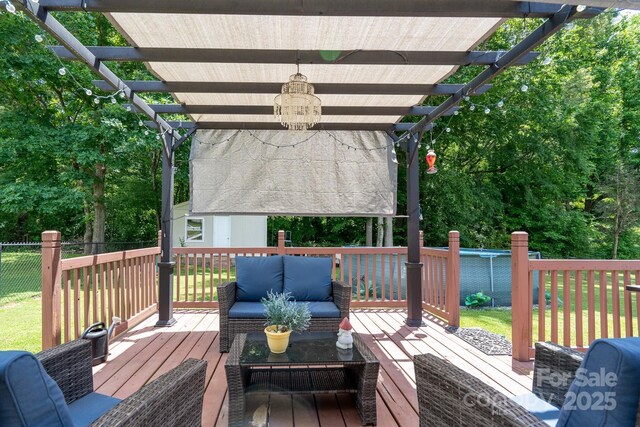 103 Poplar Trl, Rockwell, NC 28138 - deck featuring a pergola, outdoor lounge area, and an outbuilding