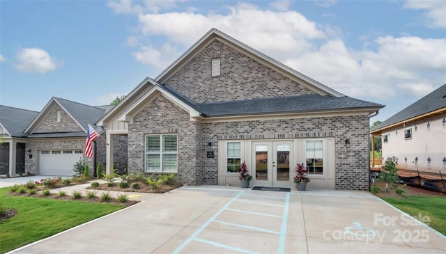411 Newstyle Way, Gastonia, NC 28056 - view of front of property featuring french doors, brick siding, and a shingled roof
