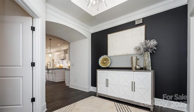 411 Newstyle Way, Gastonia, NC 28056 - entryway with dark wood finished floors, crown molding, arched walkways, and baseboards