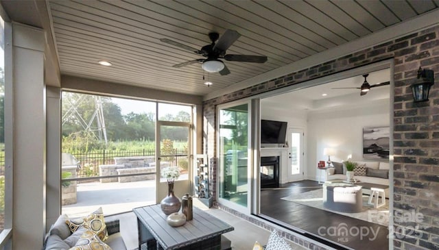 411 Newstyle Way, Gastonia, NC 28056 - sunroom featuring a ceiling fan and a glass covered fireplace