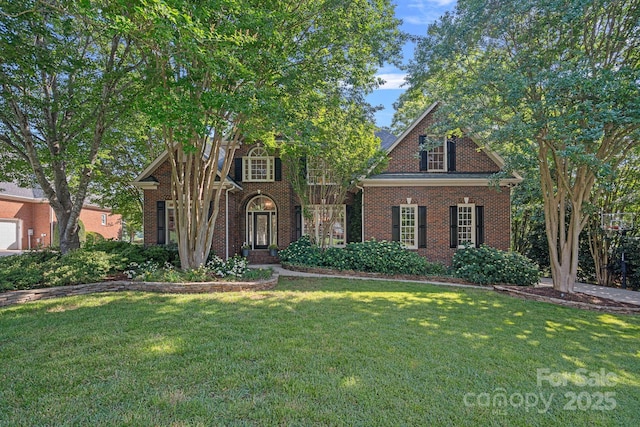 3506 Cardiff Ln, Matthews, NC 28104 - view of front of home with brick siding and a front lawn