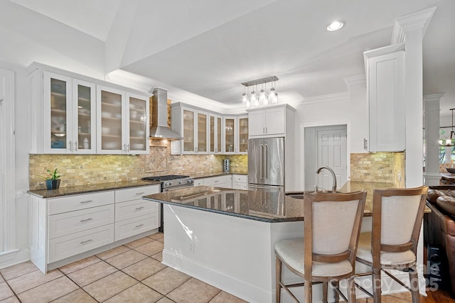 3506 Cardiff Ln, Matthews, NC 28104 - kitchen featuring stainless steel appliances, wall chimney exhaust hood, a peninsula, white cabinets, and recessed lighting