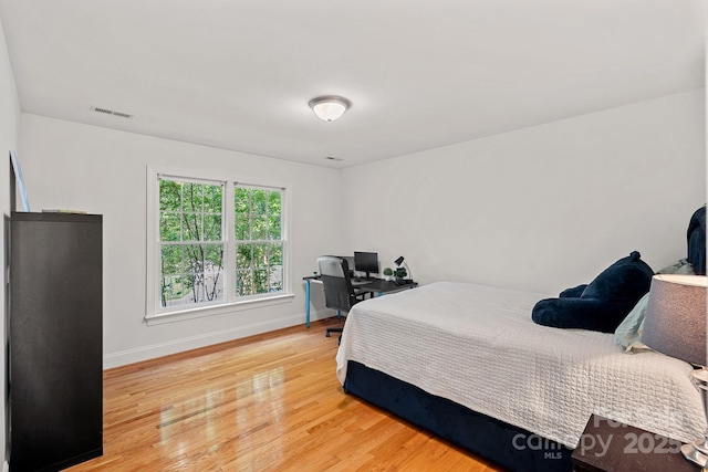 3506 Cardiff Ln, Matthews, NC 28104 - bedroom with light wood finished floors and a desk