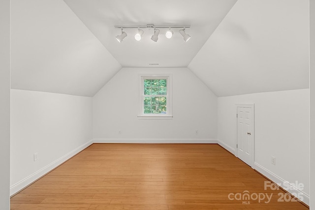 3506 Cardiff Ln, Matthews, NC 28104 - bonus room featuring light wood-style flooring and vaulted ceiling