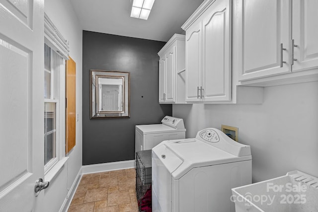 3506 Cardiff Ln, Matthews, NC 28104 - washroom featuring light stone finish flooring, cabinet space, and washer and dryer