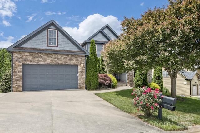 33 Stone House Rd, Arden, NC 28704 - craftsman-style home with stone siding, driveway, a garage, and a front yard