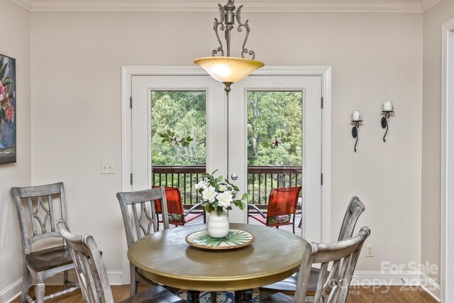 33 Stone House Rd, Arden, NC 28704 - dining space featuring ornamental molding, baseboards, and wood finished floors