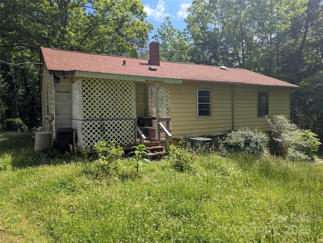 720 New Market Rd, Tryon, NC 28782 - back of property with a chimney and central air condition unit