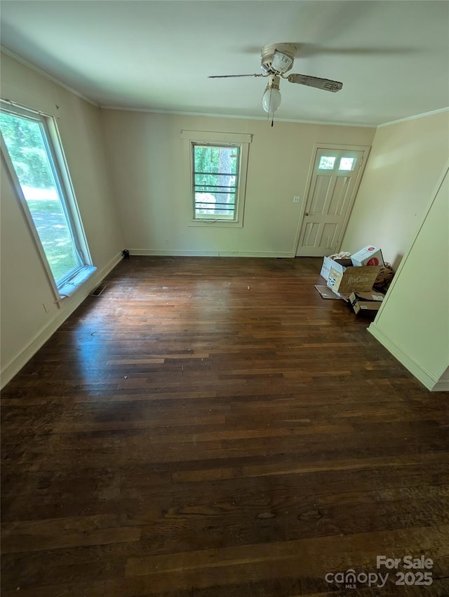 720 New Market Rd, Tryon, NC 28782 - unfurnished living room featuring ornamental molding, dark wood-style flooring, a ceiling fan, and baseboards