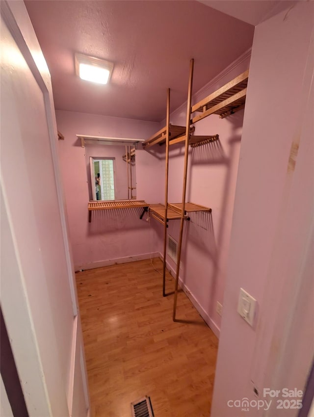 720 New Market Rd, Tryon, NC 28782 - spacious closet featuring wood finished floors
