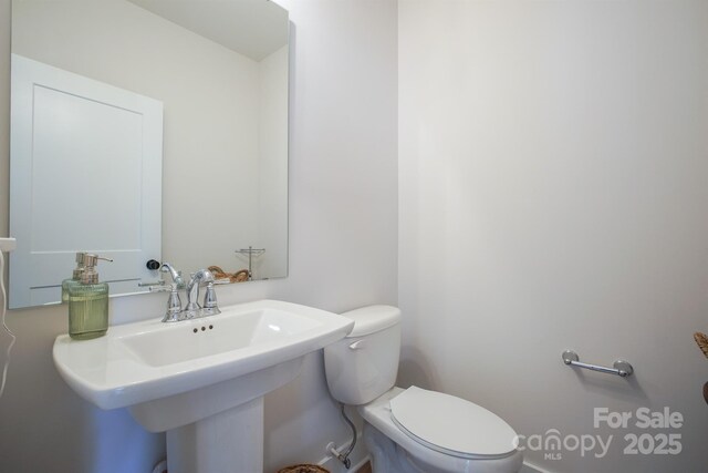 711 Beaty St, Davidson, NC 28036 - bathroom with toilet and a sink
