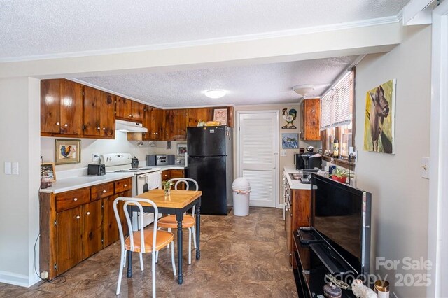 5430 Ela Rd, Whittier, NC 28789 - kitchen featuring freestanding refrigerator, a textured ceiling, light countertops, under cabinet range hood, and brown cabinets