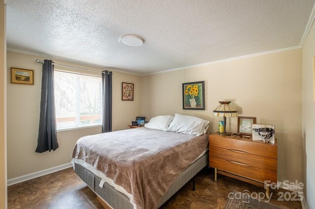 5430 Ela Rd, Whittier, NC 28789 - bedroom featuring ornamental molding, a textured ceiling, and baseboards