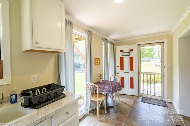 5430 Ela Rd, Whittier, NC 28789 - entryway featuring ornamental molding, baseboards, tile patterned floors, and a sink