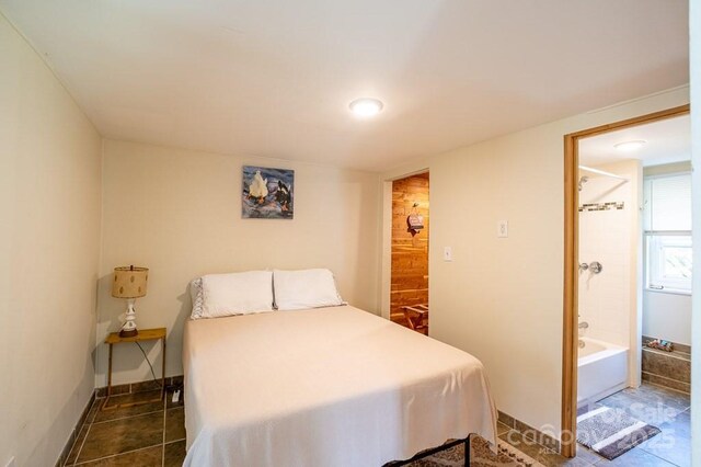 5430 Ela Rd, Whittier, NC 28789 - tiled bedroom with connected bathroom