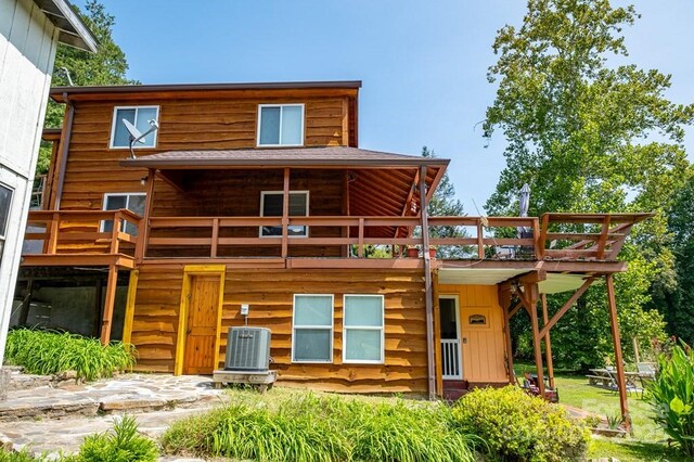 5430 Ela Rd, Whittier, NC 28789 - back of property with central air condition unit, a shingled roof, and a wooden deck