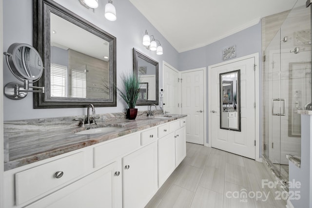 2224 Hartwell Ln, Fort Mill, SC 29707 - bathroom with a stall shower, double vanity, and crown molding