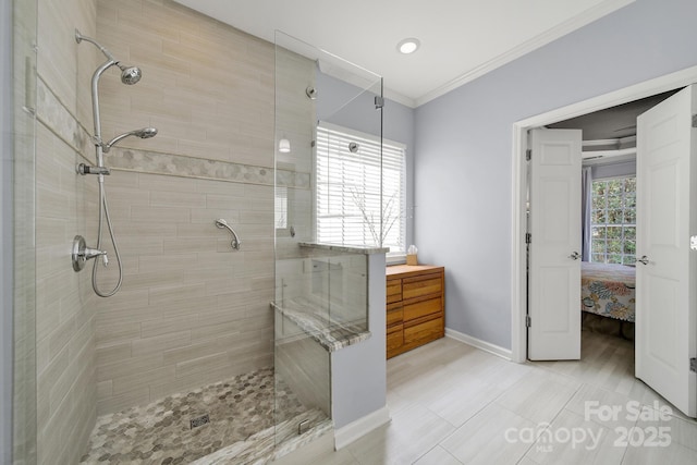 2224 Hartwell Ln, Fort Mill, SC 29707 - bathroom featuring a tile shower, baseboards, ornamental molding, and connected bathroom