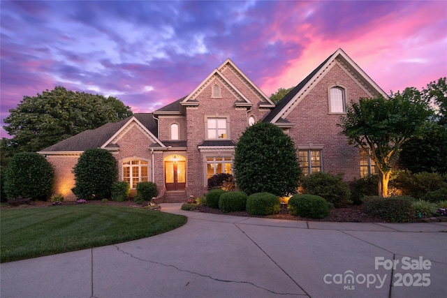 1509 Churchill Downs Dr, Waxhaw, NC 28173 - traditional-style home with brick siding and a yard