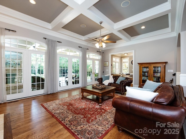 1509 Churchill Downs Dr, Waxhaw, NC 28173 - living room with ceiling fan, coffered ceiling, beamed ceiling, wood finished floors, and ornamental molding