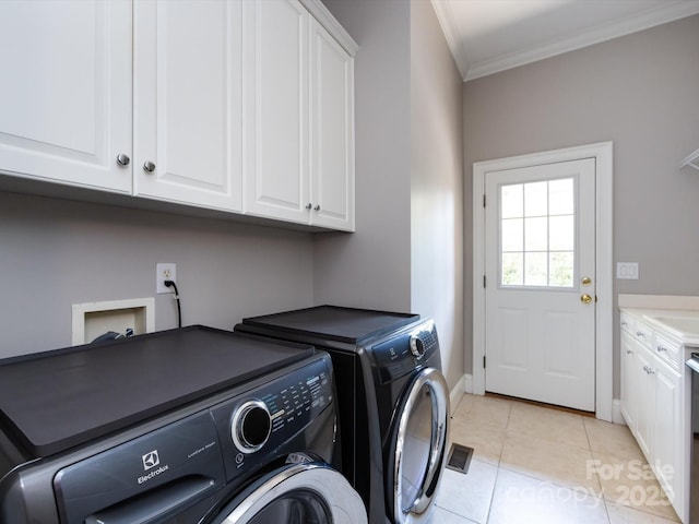 1509 Churchill Downs Dr, Waxhaw, NC 28173 - laundry room with cabinet space, separate washer and dryer, ornamental molding, light tile patterned floors, and baseboards