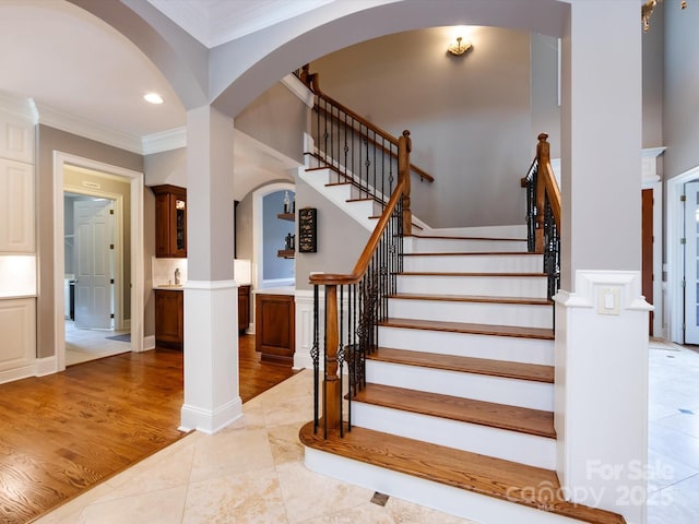 1509 Churchill Downs Dr, Waxhaw, NC 28173 - stairs featuring arched walkways, ornamental molding, recessed lighting, and wood finished floors