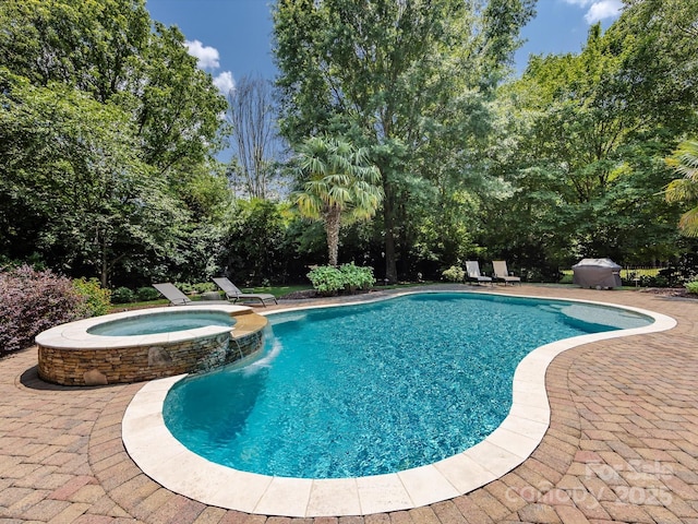 1509 Churchill Downs Dr, Waxhaw, NC 28173 - view of swimming pool with a pool with connected hot tub, a patio area, and view of scattered trees