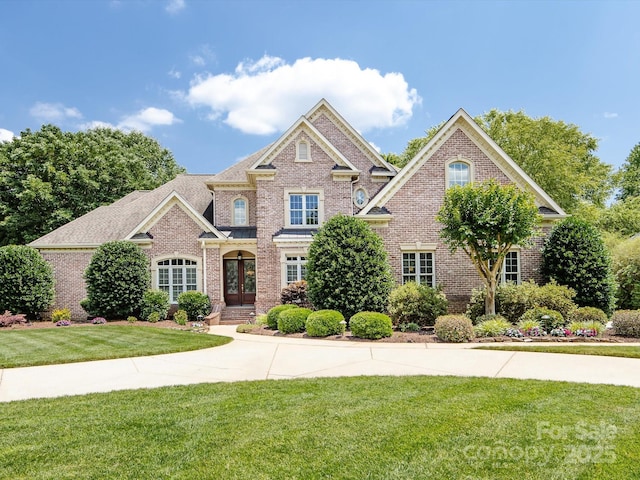 1509 Churchill Downs Dr, Waxhaw, NC 28173 - view of front facade with brick siding and a front yard