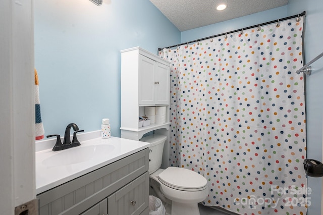 107 Ingonish Dr, Gastonia, NC 28056 - bathroom featuring toilet, curtained shower, a textured ceiling, and vanity