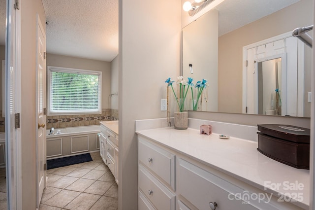 107 Ingonish Dr, Gastonia, NC 28056 - bathroom with vanity, a bath, a textured ceiling, and tile patterned floors