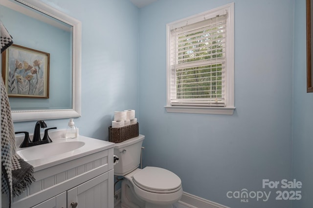 107 Ingonish Dr, Gastonia, NC 28056 - half bathroom with toilet, vanity, and baseboards