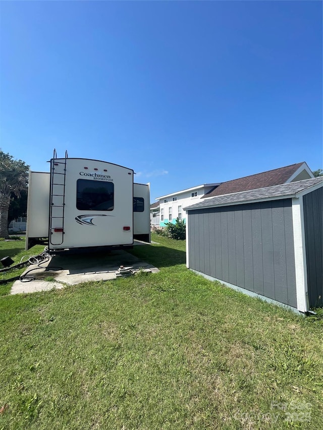 5400 Little River Neck Rd Unit 169, North Myrtle Beach, SC 29582 - view of green lawn featuring an outbuilding