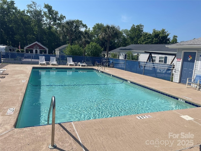 5400 Little River Neck Rd Unit 169, North Myrtle Beach, SC 29582 - community pool with a patio and view of wooded area