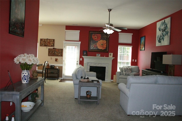 4711 Lenox Hill Pl Unit 98, Charlotte, NC 28269 - carpeted living area featuring a ceiling fan, healthy amount of natural light, and a fireplace