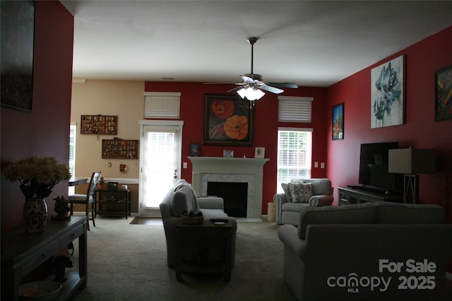 4711 Lenox Hill Pl Unit 98, Charlotte, NC 28269 - carpeted living area featuring healthy amount of natural light, a ceiling fan, and a fireplace