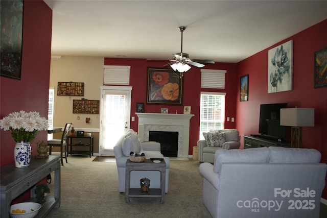 4711 Lenox Hill Pl Unit 98, Charlotte, NC 28269 - living room with healthy amount of natural light, a fireplace, a ceiling fan, and carpet floors