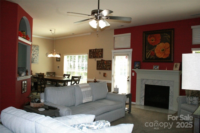 4711 Lenox Hill Pl Unit 98, Charlotte, NC 28269 - living room with ceiling fan, a chandelier, a premium fireplace, crown molding, and carpet flooring