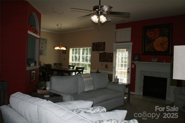 4711 Lenox Hill Pl Unit 98, Charlotte, NC 28269 - living area featuring ceiling fan, a chandelier, a premium fireplace, and ornamental molding