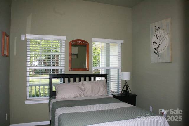 4711 Lenox Hill Pl Unit 98, Charlotte, NC 28269 - bedroom with multiple windows and baseboards