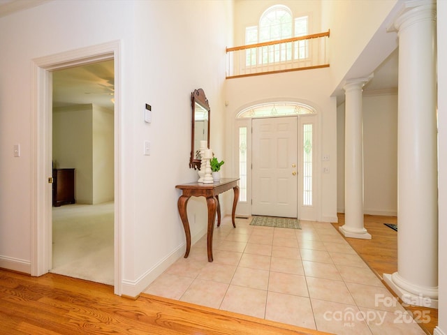 1209 S S St, Gastonia, NC 28052 - foyer with ornate columns, plenty of natural light, light tile patterned floors, and a towering ceiling